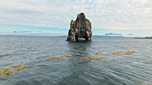 Aerial view of Hvitserkur rock formation, Iceland. Dramatic sea stack standing in the ocean off Vatnsnes Peninsula.