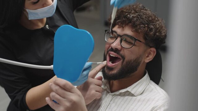 Dental care experience in a clinic with patient receiving treatment on a relaxing day