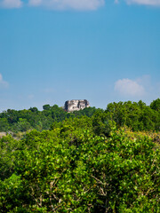 View over rainforest towards Temple 216, Yaxha Archaeological Site, Peten Department, Guatemala