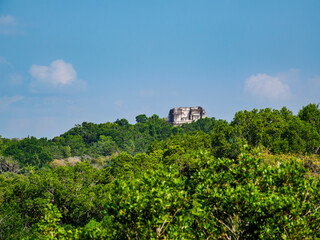 View over rainforest towards Temple 216, Yaxha Archaeological Site, Peten Department, Guatemala