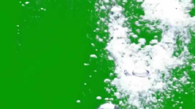 Water Bubbles Rising on Green Screen Background for Underwater and Liquid Effects.