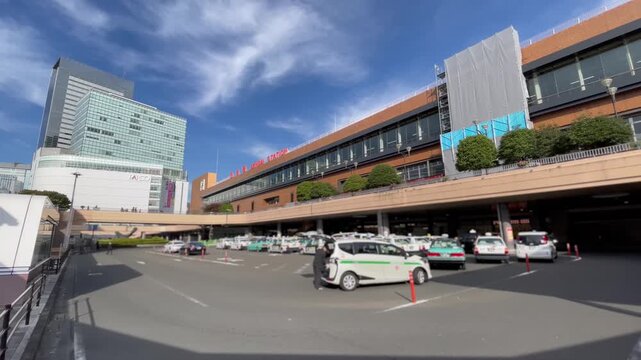 SENDAI, MIYAGI, JAPAN - NOV 2025 : Exterior of Sendai station. Major junction railway station in Aoba-ku downtown district. Transportation, travel and tourism concept video. Shot in sunny daytime.