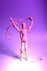 Wooden puppet with strings. Concept of emotional manipulation,dictatorship and control