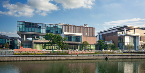 Naklejka premium Modern Architectural Marvels by the Water Highlighting Urban Living and Design