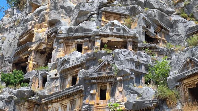 Rock-cut tombs of the ancient Lycian necropolis. Myra is an antique town in Lycia where the small town of Kale (Demre) Turkey. Close-up of rock cut tomb grave.