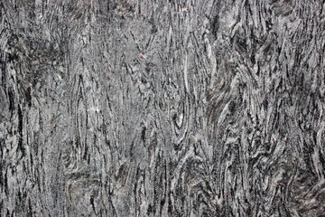 Close-up of rough rock surface with natural crack