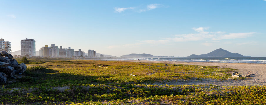 Panoramic view of the beach in the city of Navegantes on a sunny day, Santa Catarina, Brazil.