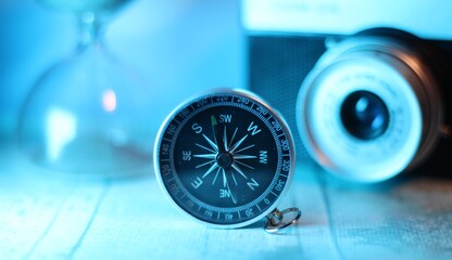 Compass hourglass and camera travel search way memory timer concept photo