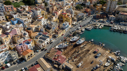 Aerial view of a small seaside village. The houses are located on the waterfront of Sciacca, in the province of Agrigento, Sicily, Italy. It overlooks Mediterranean Sea.