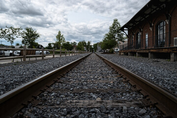 Railroad Tracks in Lewisburg Pennsylvania &ndash; Low Angle Perspective of Historic Train Station
