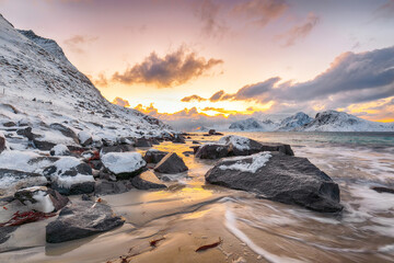 Amazing winter view of Vik beach during sunset with lots of snow  and snowy  mountain peaks near Leknes.
