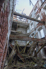 Dilapidated building with a lot of debris and broken wood