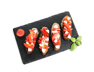 Tasty bruschettas with tomatoes, mozzarella cheese and basil isolated on white, top view