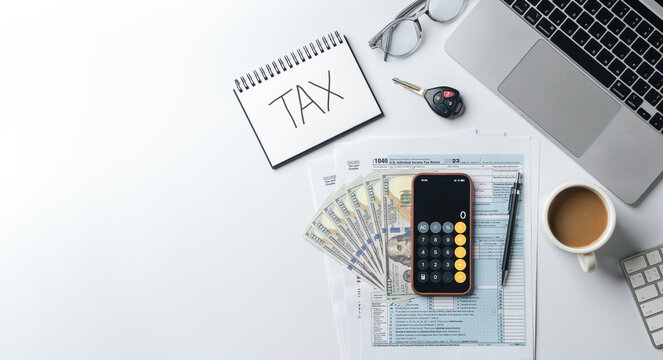 Tax and financial planning concept. Car tax. Top view. Notebook with tax records, calculator, dollar bills, tax forms, laptop and coffee cup for annual tax preparation. Copy space. - Powered by Adobe
