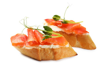 Tasty bruschettas with salmon, cream cheese and microgreens isolated on white