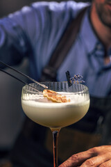 Bartender garnishing cocktail