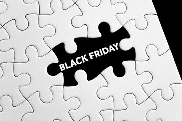 Fototapeta premium business concept puzzle piece with black friday message
