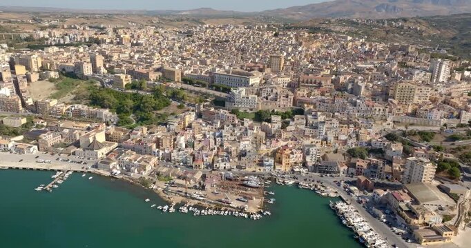 Aerial view of the town of Sciacca, Sicily, Italy. This village has a small harbor overlooking the crystal-clear waters of the Mediterranean Sea. 
