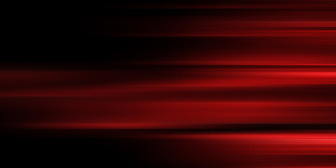 The effect of red light in fast motion on a black background. blurred abstract background with long exposure. neon light
