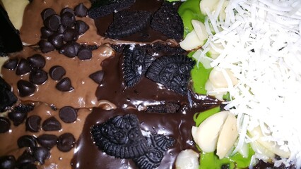 Very delicious chocolate cake close up shot. chocolate cake with cream and chocolate