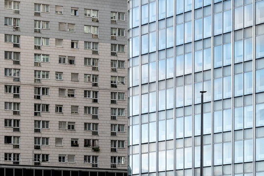 Contemporary urban architecture with city skyline of residential apartments and modern office building under cloudy daylight in central Paris