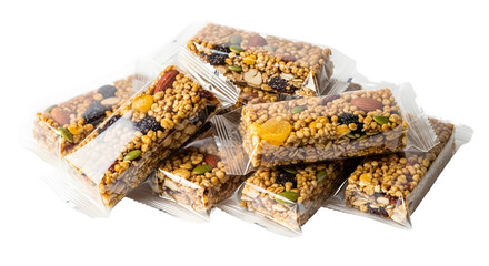 Pile of granola bars in clear wrappers isolated on transparent background, healthy snack option for energy boost