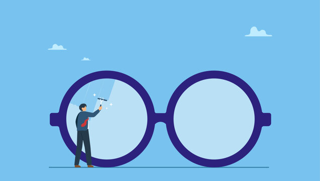 Businessman cleaning huge eyeglass lenses for owner to get clear vision. Clear business vision, see through lenses in details or clean and clear business outlook.