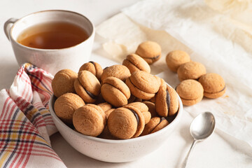 "Baci di dama," shot from the front to highlight their perfect shape and the thin layer of chocolate cream that joins the two halves.