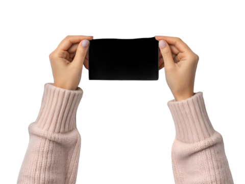 Woman's hands holding black screen: A close-up shot of a woman's hands, delicately holding a sleek, black screen. The image presents a clean and modern aesthetic.