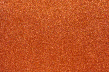 Colorful orange glitter background for holiday design textures