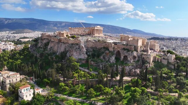 Aerial drone cinematic video of iconic Acropolis hill and the Parthenon featuring Erechtheion and Porch of the Caryatids, Athens historic centre, Attica, Greece
