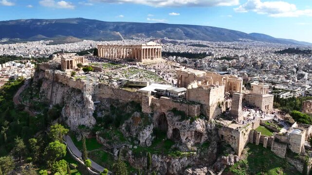 Aerial drone cinematic video of iconic Acropolis hill and the Parthenon featuring Erechtheion and Porch of the Caryatids, Athens historic centre, Attica, Greece