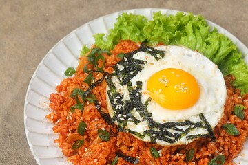 Kimchi bokkeumbap (kimchi fried rice) is a Korean dish consisting of rice fried with kimchi.