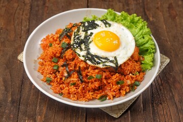 Kimchi bokkeumbap (kimchi fried rice) is a Korean dish consisting of rice fried with kimchi.