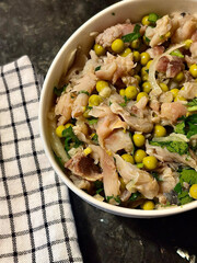 Appetizer in the form of a salad with herring, peas and onions