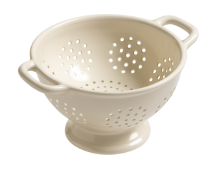 Glazed ceramic colander, perfect for stylishly draining salads in modern kitchens.