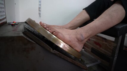 A traditional brass foot massager designed to stimulate pressure points, improve blood circulation, relieve stress and promote overall foot relaxation naturally.