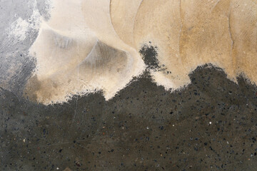 Stained concrete floor with natural black and beige abstract patterns for modern interior background and flooring design concept