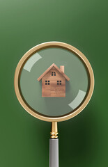 Magnifying glass with red and wooden house