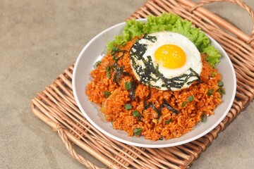 Kimchi bokkeumbap (kimchi fried rice) is a Korean dish consisting of rice fried with kimchi.