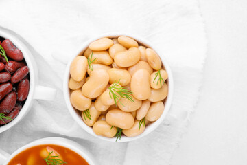 Kidney, butter and baked beans in bowls on towel for protein food, clean eating or vegan variety concept