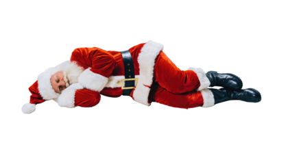 Santa claus lying down asleep wearing a red suit with white trim and black boots on a png background