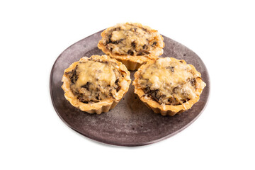 Tartlets with meat and cheese isolated on white. side view, copy space