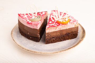 Chocolate cake on white wooden, side view, close up