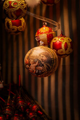 The golden light reflects on the Christmas ornaments.