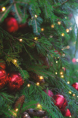 Festive pine tree decoration captured with a cozy, bokeh-filled Christmas background