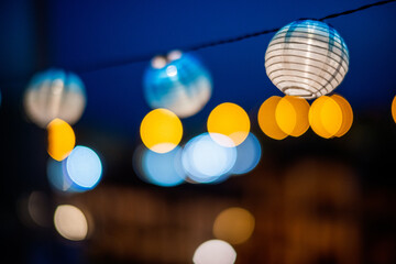 Night celebration with glowing lanterns on the terrace