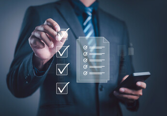 Businessman using digital checklist for task management, productivity planning, and performance...