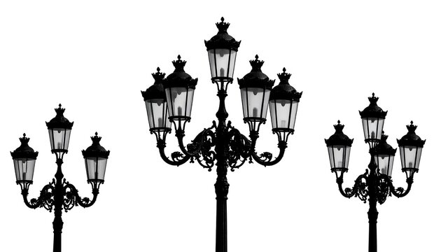 Fototapeta Silhouette of Vintage Street Lamps Against a White Background.