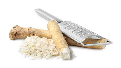 Whole and grated horseradish roots near grater isolated on white